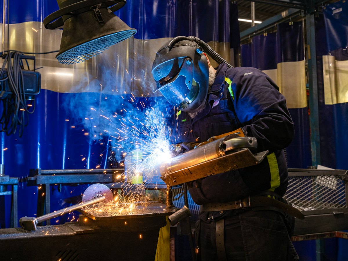Welder at work in a fabrication workshop